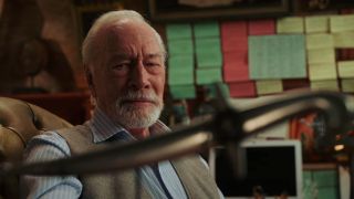Christopher Plummer looking at a dagger in Knives Out