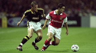 22 Sep 1999: Marc Overmars of Arsenal and Krister Nordin of Solna in action during the UEFA Champions League match between Arsenal v AIK Solna, played at Wembley Stadium, London. The game finished in a 3-1 victory for Arsenal. \ Mandatory Credit: Clive Mason /Allsport