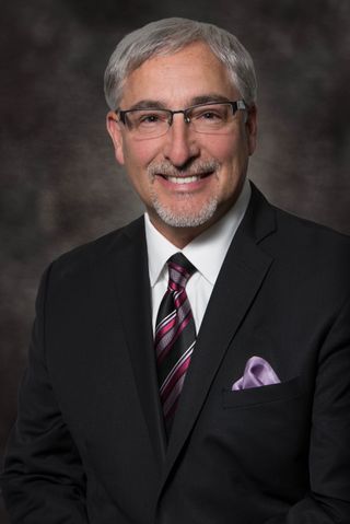 Smiling headshot of Ken Cawthorne.