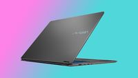 An MSI Prestige N16 Flip AI+ gaming laptop on a pink and blue background.