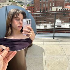 Jamie taking a mirror selfie outside 