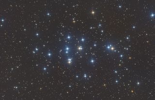 a cluster of blue-white stars in space