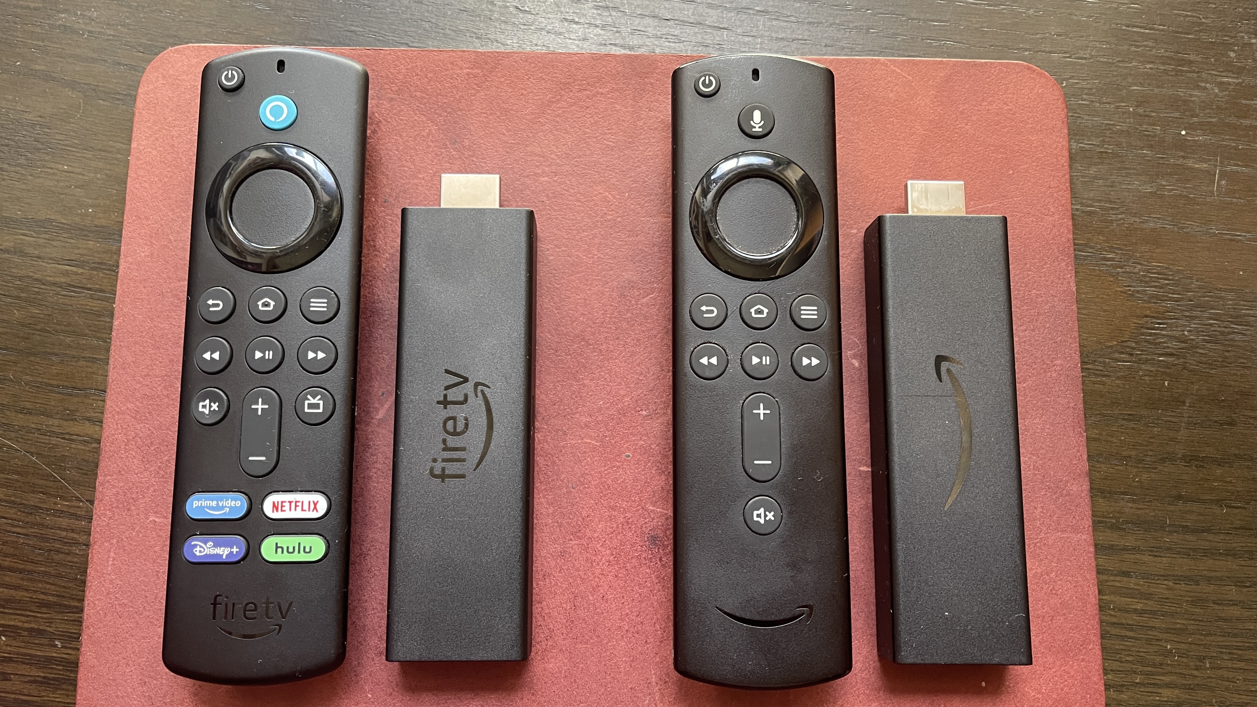 Amazon Fire TV Stick 4K Max and remote alongside the Amazon Fire TV Stick 4K and its remote