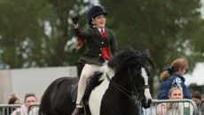 Matilda Mason punches the air as she and Flash Dance canter from the ring having won the Lincolnshire HOYS junior coloured qualifier