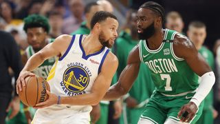  Jaylen Brown #7 of the Boston Celtics guards Stephen Curry #30 of the Golden State Warriors