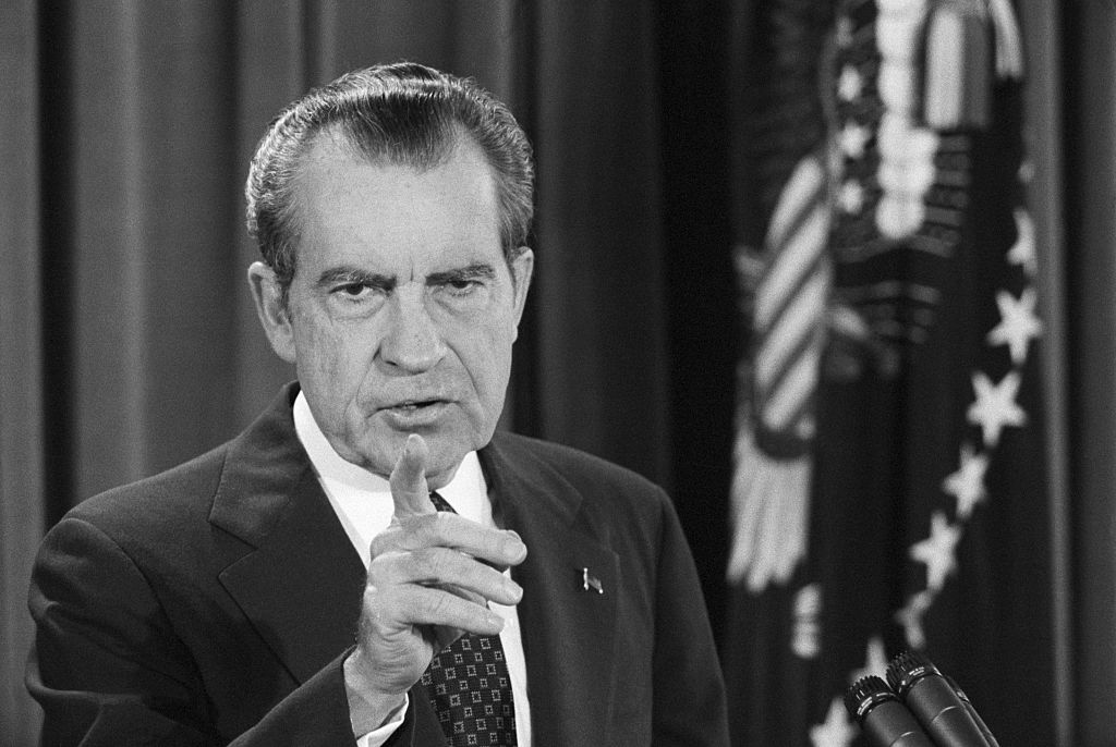 President Nixon points to a reporter during his televised news conference in the East Room of the White House