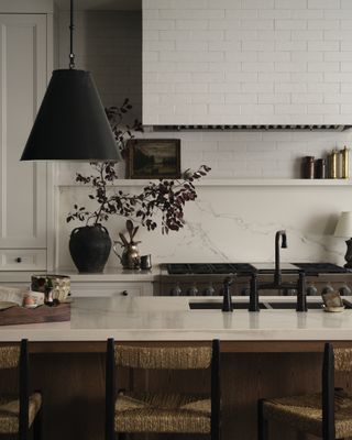 A kitchen with tiled range hoods