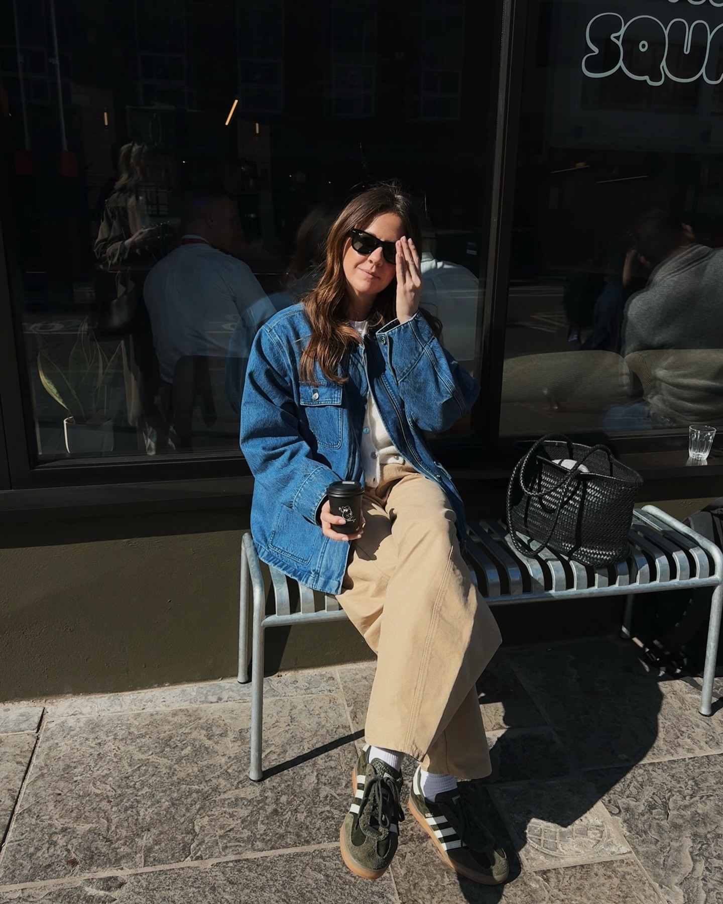 kim turkington wears a denim jacket, khaki jeans and trainers