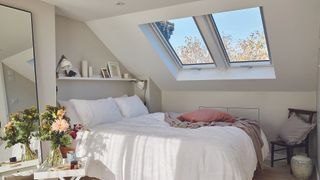 grey bedroom in loft conversion with velux rooflights