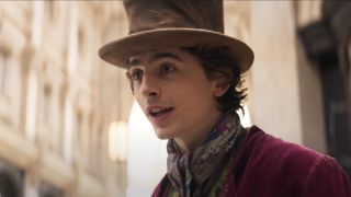 Timothée Chalamet giving a speech in a square in Wonka.