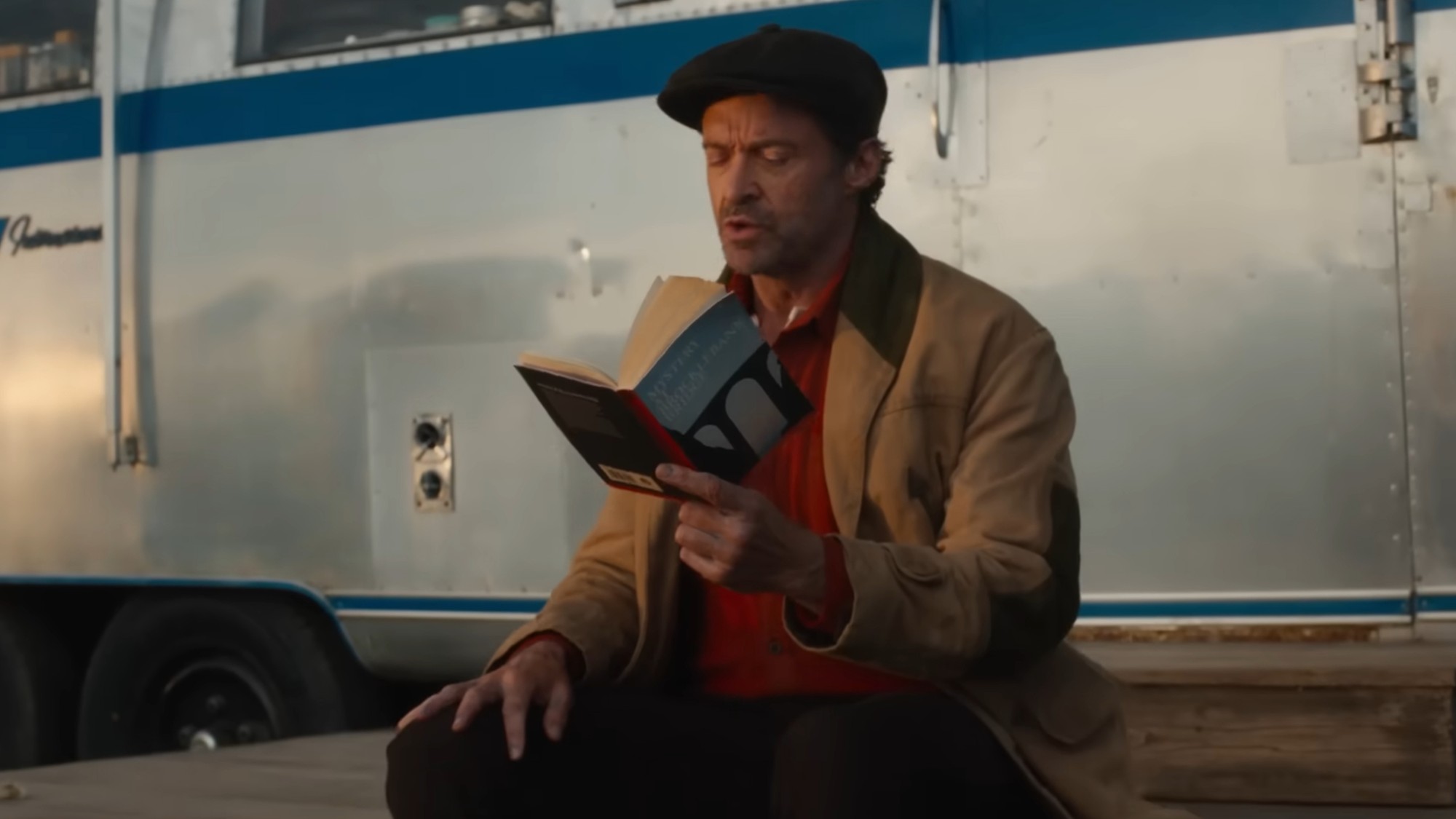 Hugh Jackman reading in The Sheep Detectives.