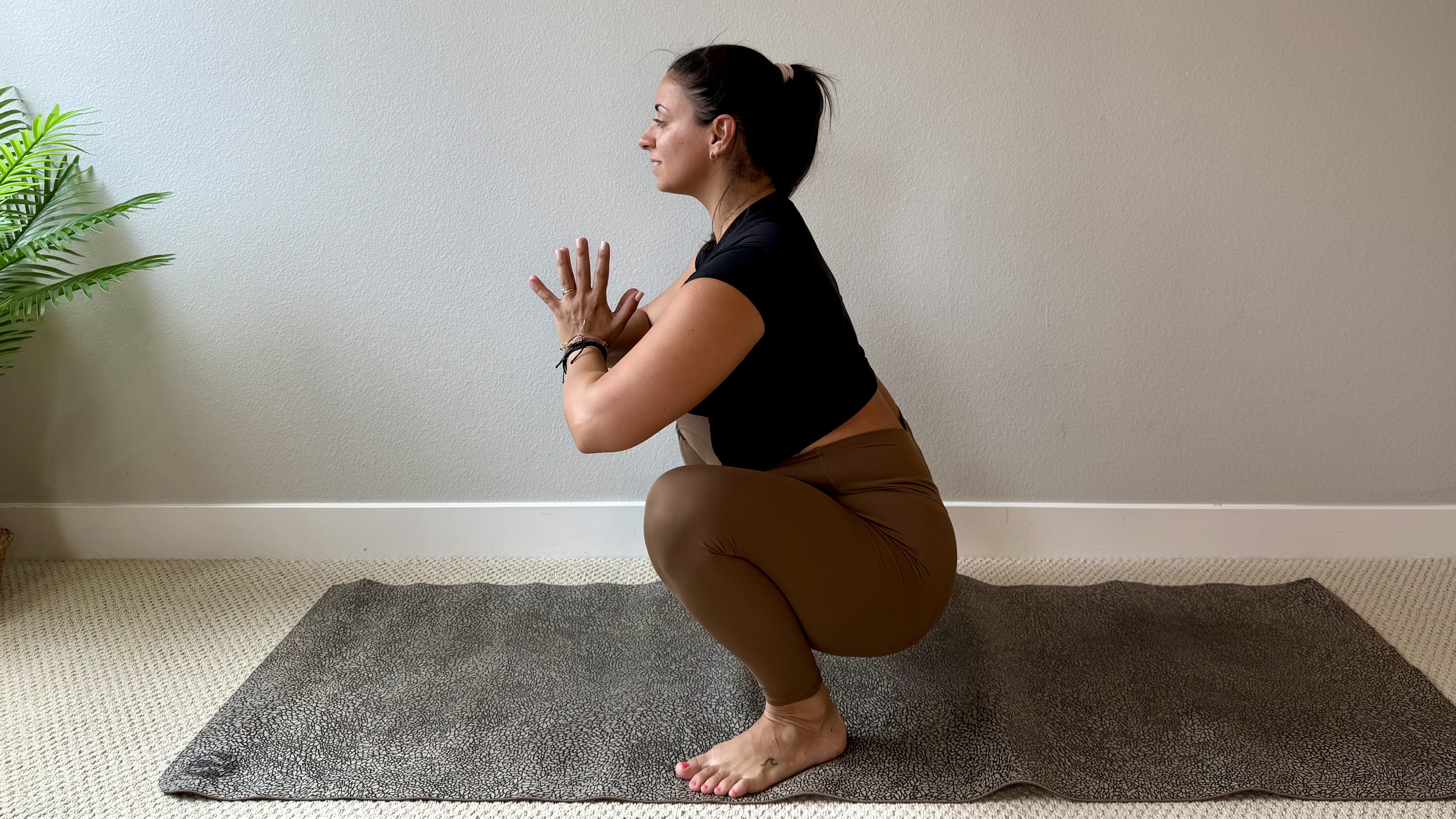 Elma Panagaki performs a deep squat.