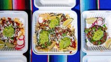 Three styrofoam boxes of tacos