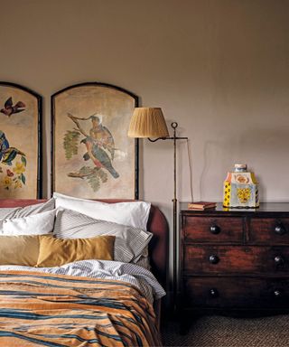 Red bedhead, wooden cabinet, bird design, yellow lamp
