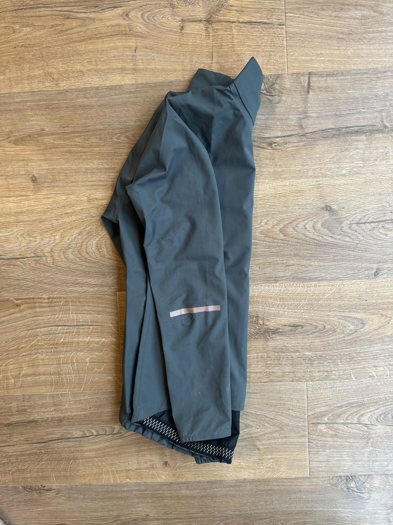 Side profile of jacket showing off the reflective sleeve detail