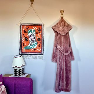 wall hooks with wall hanging and dressing gown