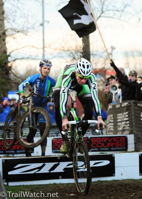 Jeremy Powers hops the barriers on his way to the win in Portland ahead of a lapped rider.