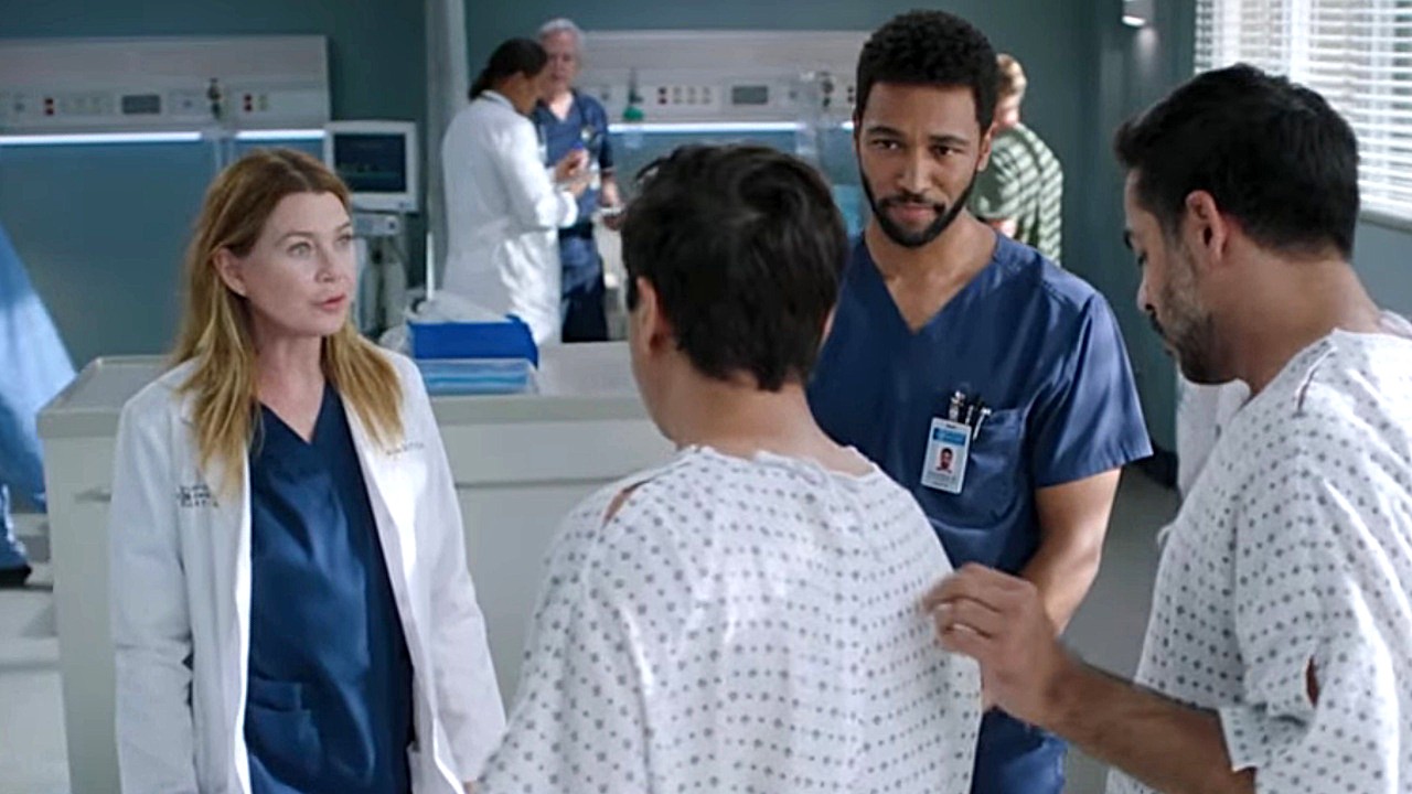 Meredith Grey (Ellen Pompeo) and Winston Ndugu (Anthony Hill) consult with patients in the episode "Between Two Lungs" on Grey's Anatomy Season 22.