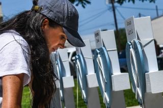 Meghan Markle Meghan Markle, the wife of Britain's Prince Harry, places flowers as she mourns at a makeshift memorial outside Uvalde County Courthouse in Uvalde, Texas, on May 26, 2022. - Grief at the massacre of 19 children at the elementary school in Texas spilled into confrontation on May 25, as angry questions mounted over gun control -- and whether this latest tragedy could have been prevented. The tight-knit Latino community of Uvalde on May 24 became the site of the worst school shooting in a decade, committed by a disturbed 18-year-old armed with a legally bought assault rifle. (Photo by CHANDAN KHANNA / AFP) (Photo by CHANDAN KHANNA/AFP via Getty Images)
