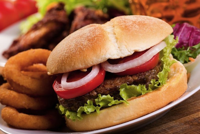 Hamburger with onion rings. 