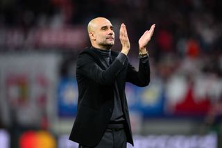 Head coach Pep Guardiola of Manchester celebrates victory after the UEFA Champions League match between RB Leipzig and Manchester City at Red Bull Arena on October 04, 2023 in Leipzig, Germany. (Photo by Marvin Ibo Guengoer - GES Sportfoto/Getty Images)