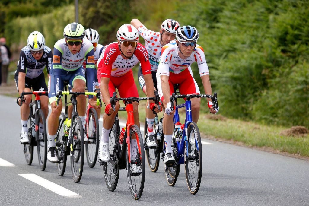 MRDEBRETAGNE GUERLDAN FRANCE JUNE 27 Edward Theuns of Belgium and Team Trek Segafredo Ide Schelling of The Netherlands and Team BORA Hansgrohe Polka Dot Mountain Jersey Anthony Perez of France and Team Cofidis Simon Clarke of Australia and Team Qhubeka NextHash Jrmy Cabot of France and Team Team TotalEnergies Jonas Koch of Germany and Team Intermarch Wanty Gobert Matriaux in breakaway during the 108th Tour de France 2021 Stage 2 a 1835km stage from PerrosGuirec to MrdeBretagne Guerldan 293m LeTour TDF2021 on June 27 2021 in MrdeBretagne Guerldan France Photo by Chris GraythenGetty Images