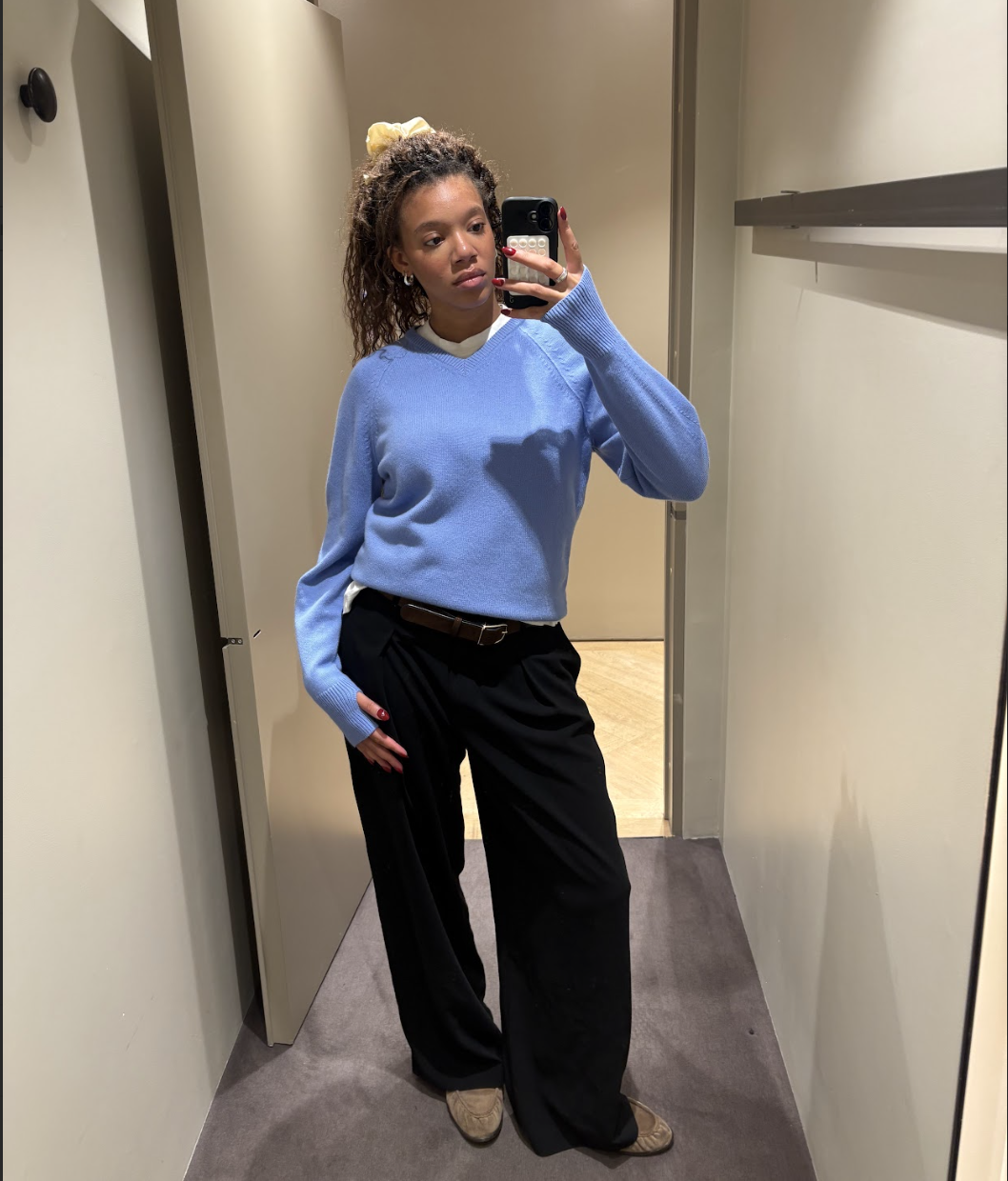 Fashion editor Imani wears the cos expensive looking knitwear.