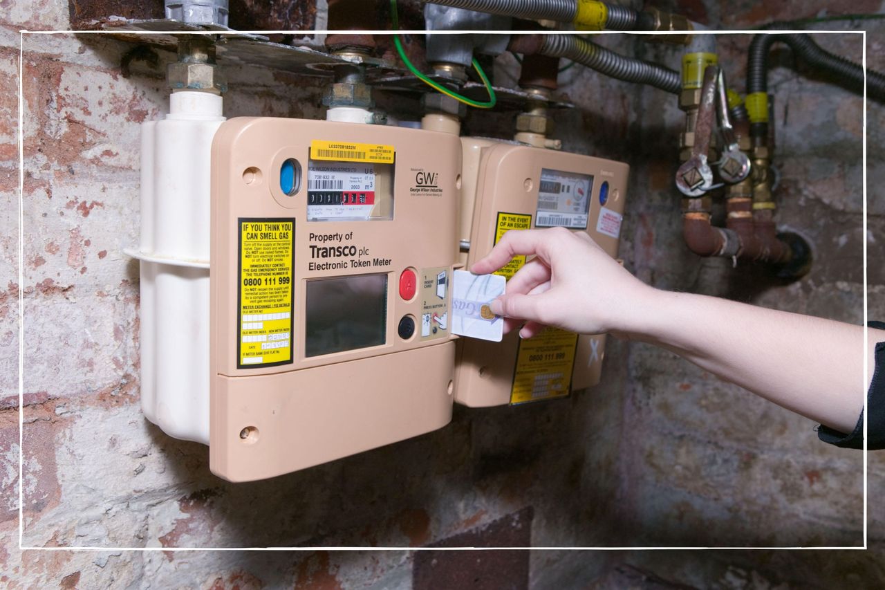 Woman topping up her prepayment meter