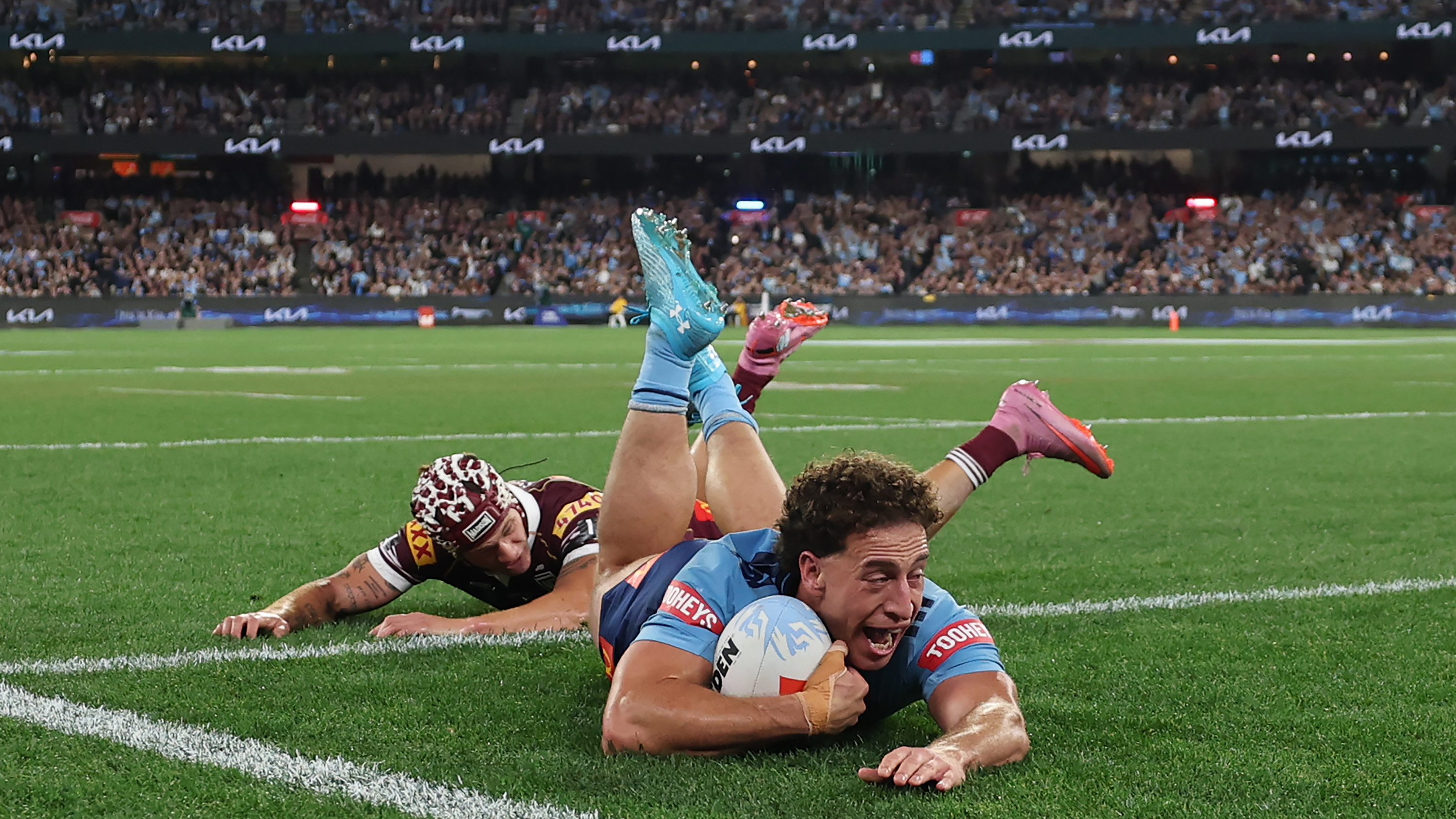 Mark Nawaqanitawase of the Blues scores a try during game two of the Men's State of Origin series between New South Wales Blues and Queensland Maroons