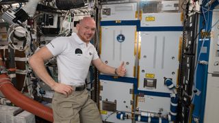 German astronaut Alex Gerst of the European Space Agency poses with the Advanced Closed-Loop System (ACLS) at the International Space Station on Oct. 19, 2018.