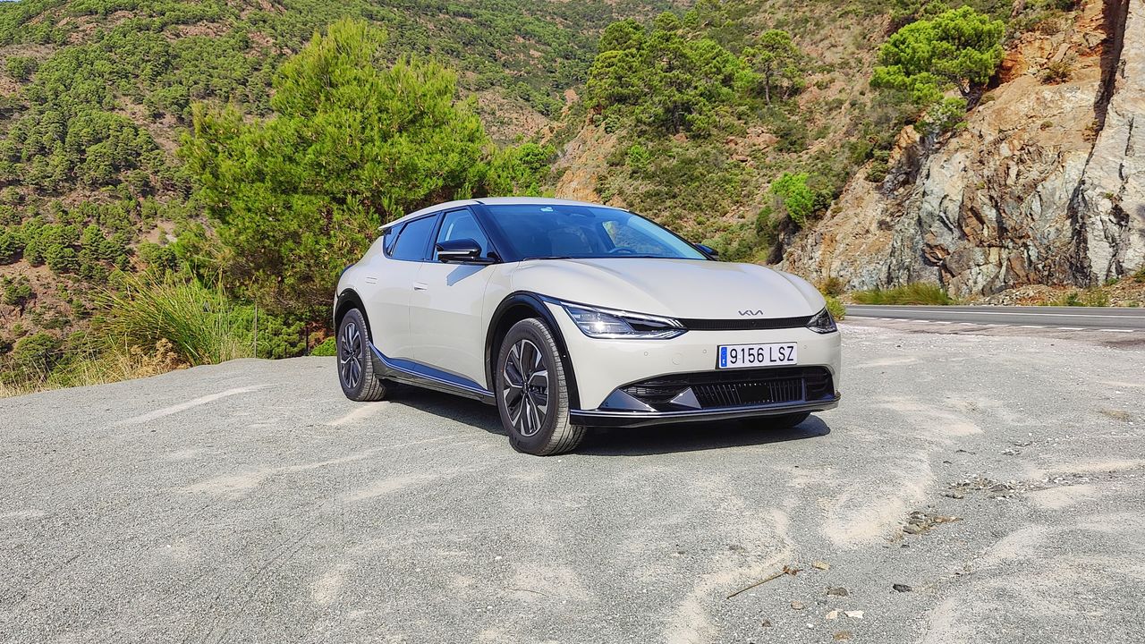 Front on, at an angle, view of Kia EV6 parked in a layby in the mountains