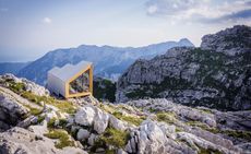 Modern storm shelter built into mountain terrain
