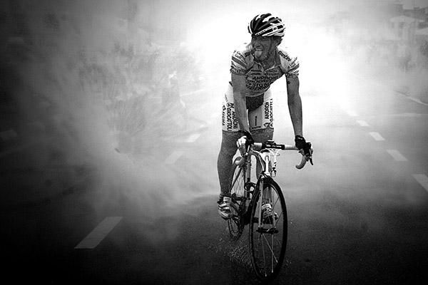 A rider from the Androni Giocattoli team cleans his bike as well as himself after stage three finished in Sitiawan.