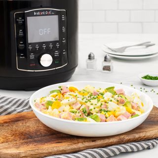 Instant Pot Pro on a white counter top with egg salad