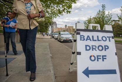 People drop off their ballots in Dayton, Ohio, this April.