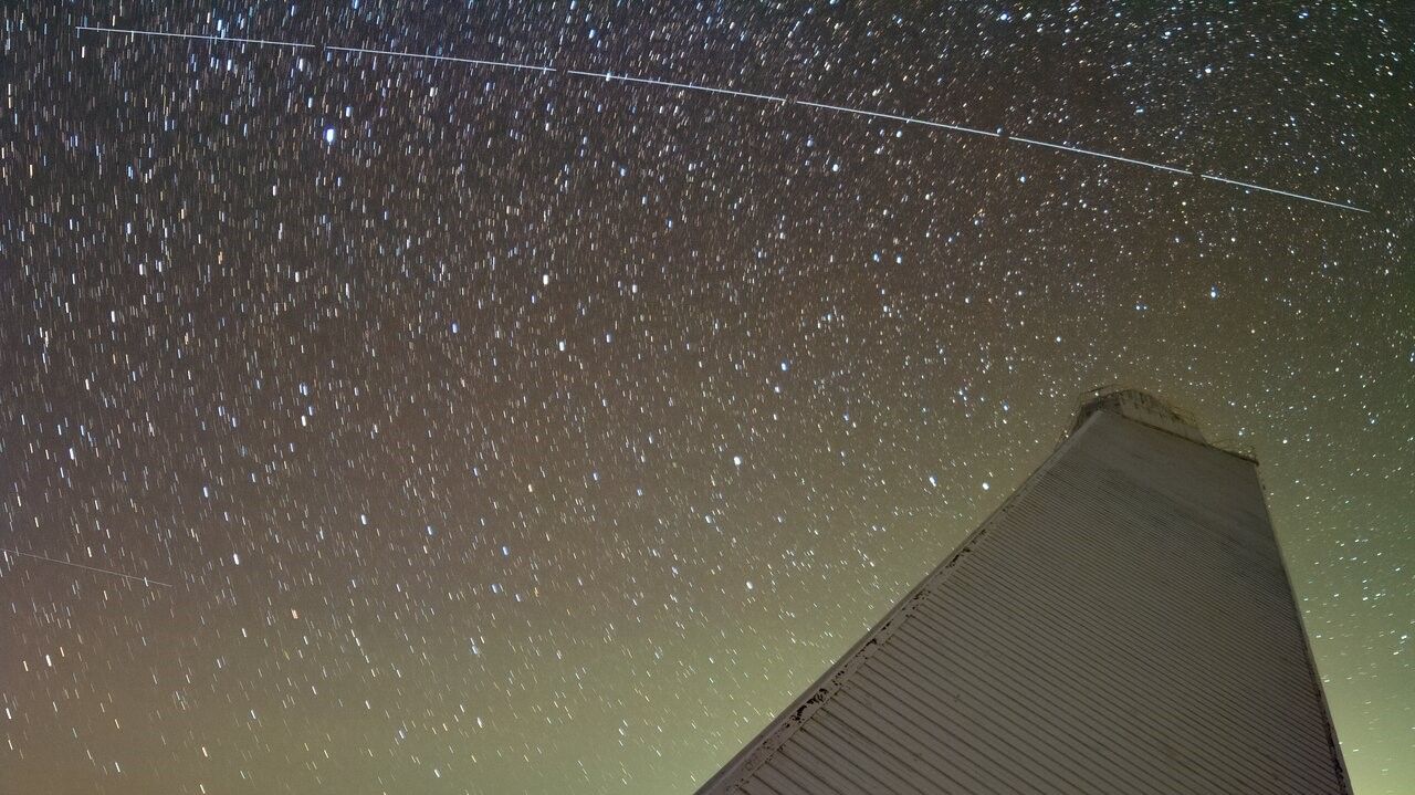 Trail left by BlueWalker 3 over McMath-Pierce Solar Telescope at Kitt Peak National Observatory, a Program of NSF's NOIRLab.