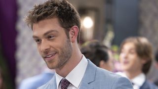 Evan Hofer as Dex smiling at a wedding in General Hospital