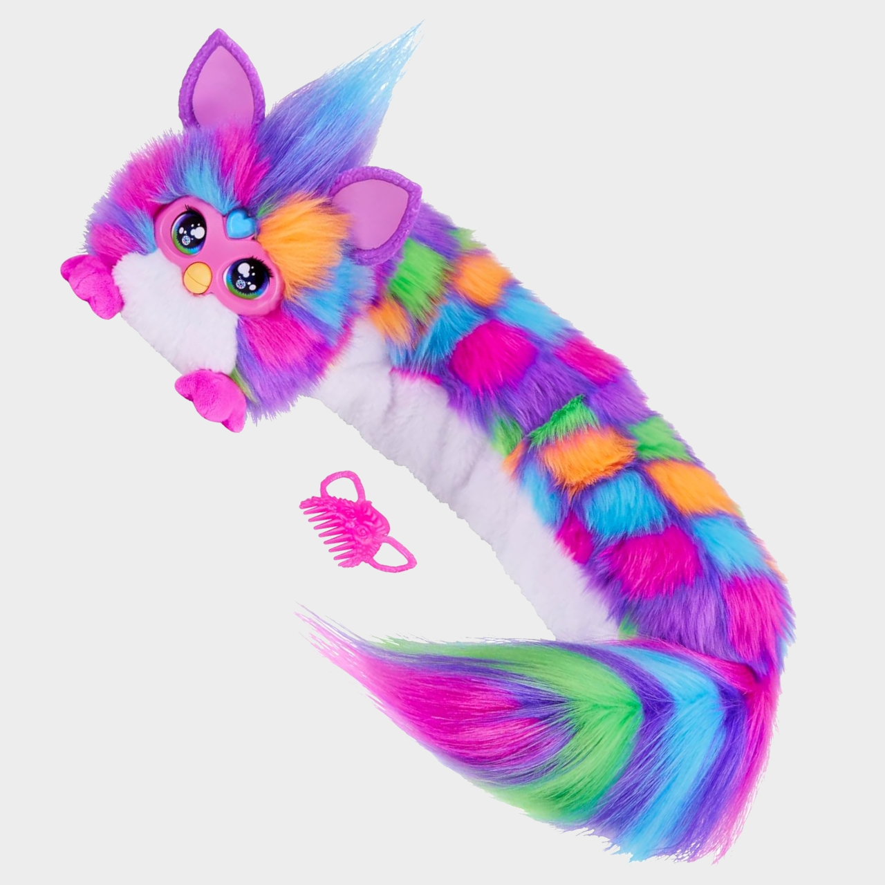 DJ Furby and hair brush on a plain background