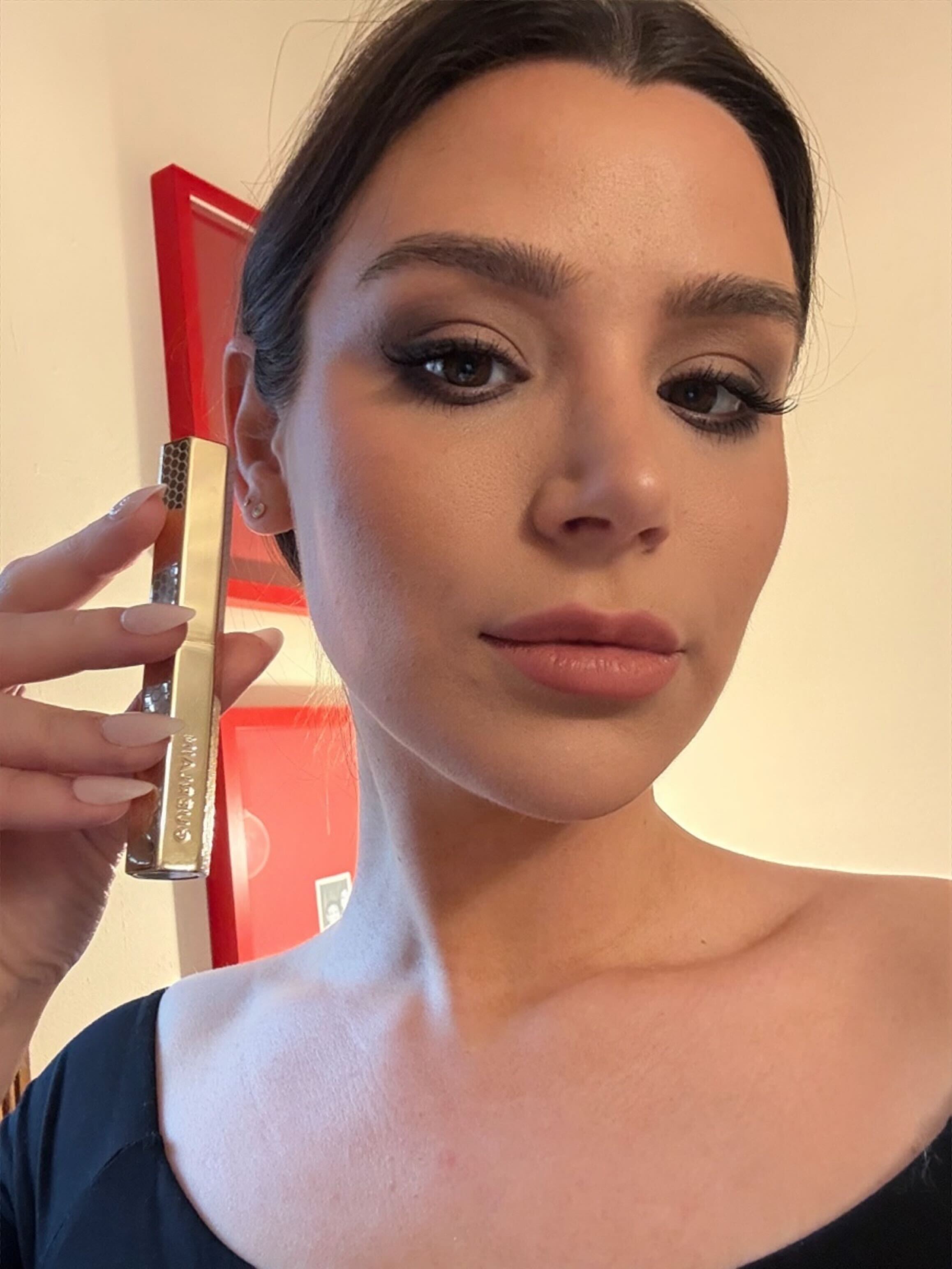 Siena Gagliano after applying the Guerlain KISSKISS Lipstick.