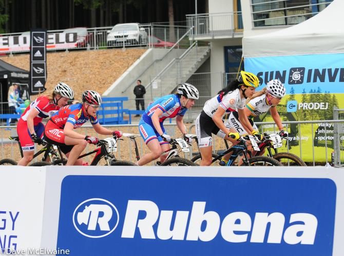 Candice Neethling (BMC) leads a large group out from the start/finish
