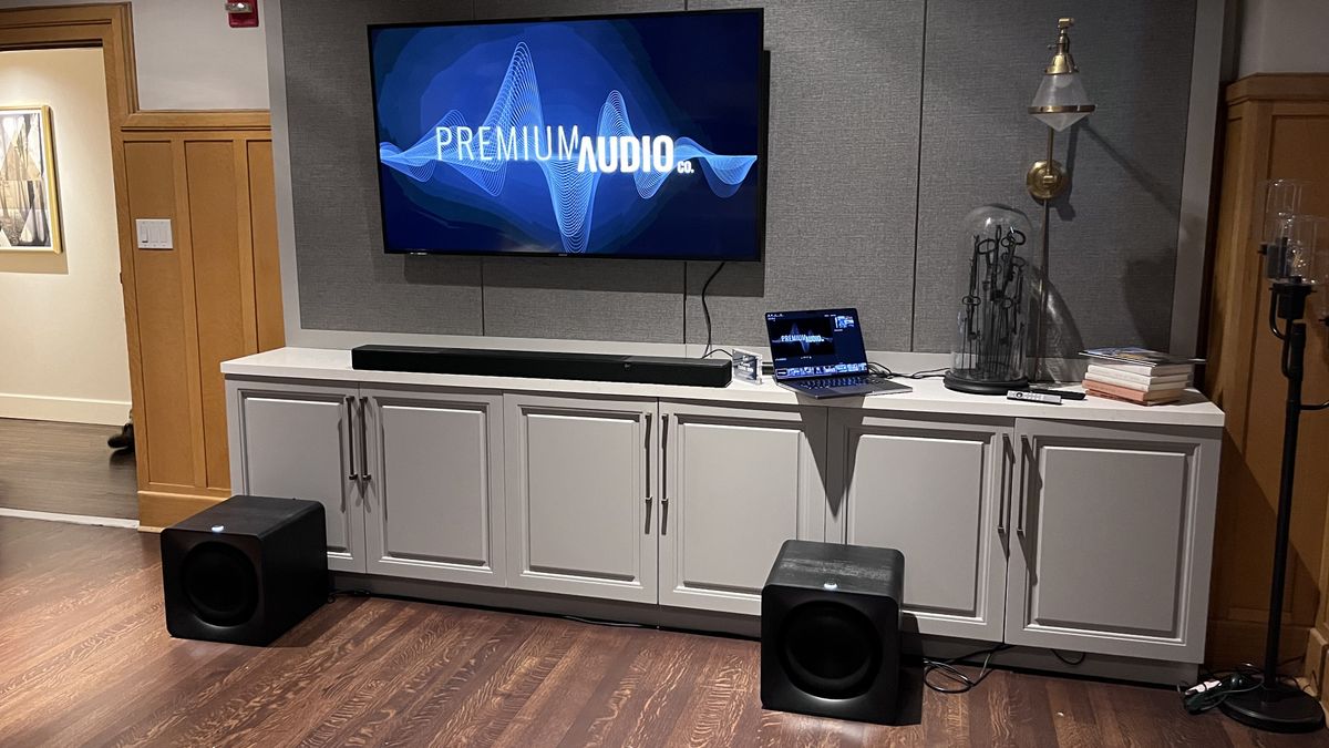 Klipsch Flexus Core 300 soundbar on TV stand with TV screen