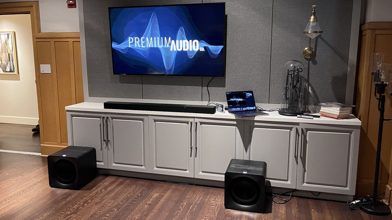 Klipsch Flexus Core 300 soundbar on TV stand with TV screen