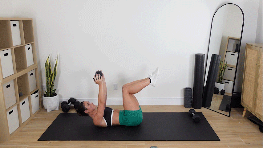 trainer doing weighted windsheild wipers with a dumbbell