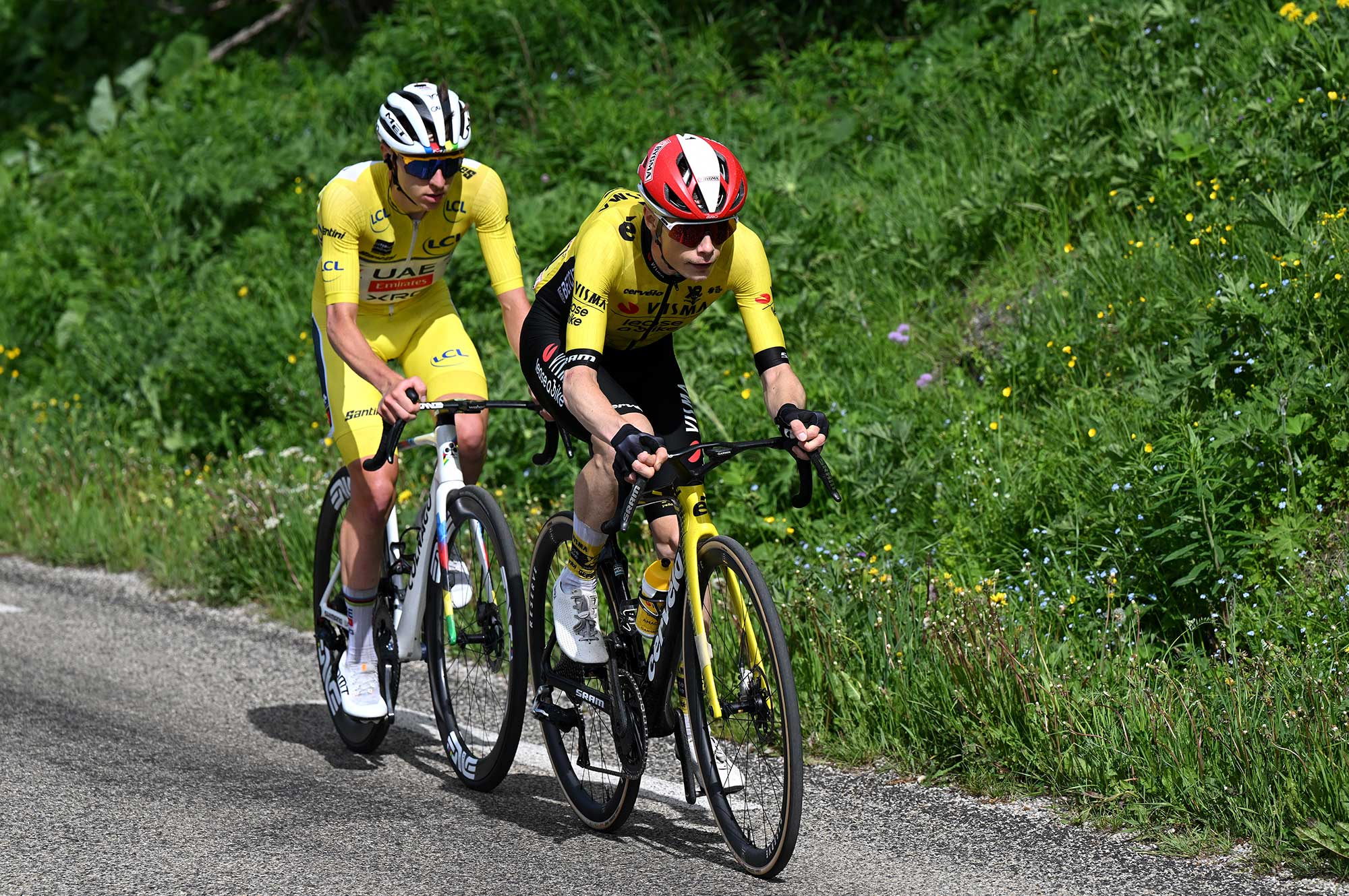 PLATEAU DU MONT-CENIS, FRANCE - JUNE 15: (L-R) Tadej Pogacar of Slovenia and UAE Team Emirates - XRG - Yellow leader jersey and Jonas Vingegaard of Denmark and Team Visma | Lease a Bike compete in the chase group during the 77th Criterium du Dauphine 2025, Stage 8 a 133.3km stage from Val-d&#039;Arc to Plateau du Mont-Cenis 2095m / #UCIWT / on June 15, 2025 in Plateau du Mont-Cenis, France.