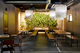 Tables and benches inside Lynk & Co Offices, Gothenburg, by New Order Arkitektur