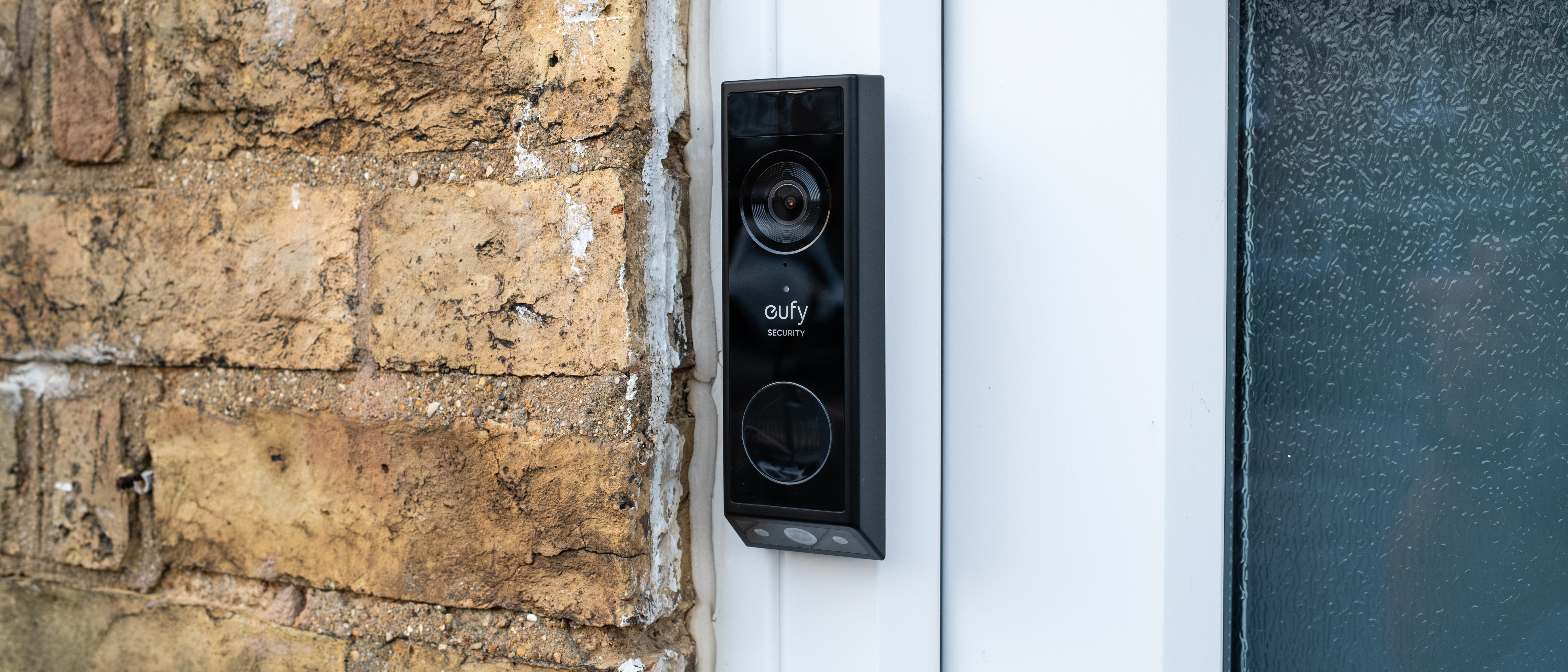 Eufy Video Doorbell E340 installed next to a front door