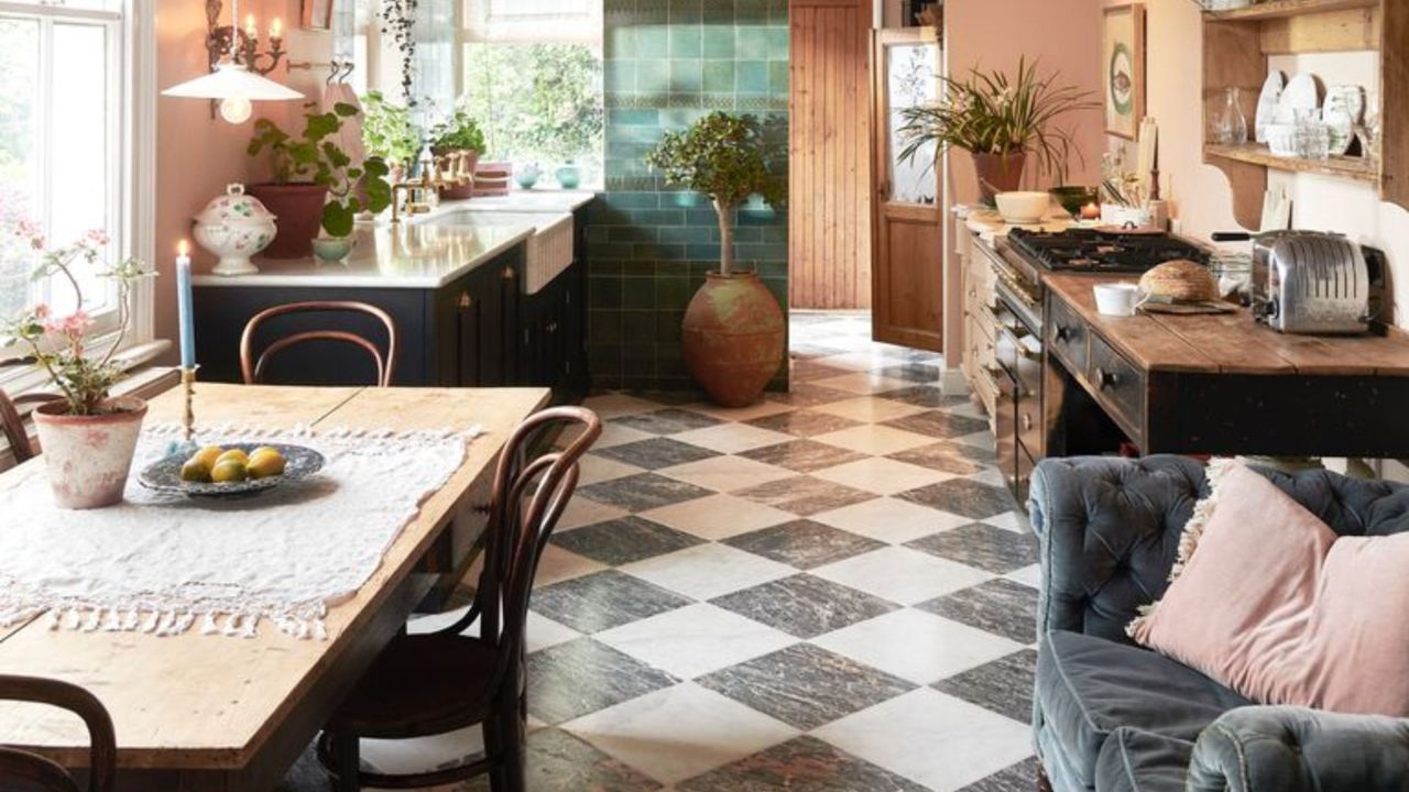 Blush kitchen with black and white floor