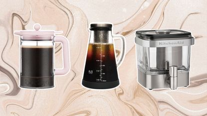 A trio of cold brew coffee makers from Bodum, Ovalware and KitchenAid on swirly brown marble effect graphic background