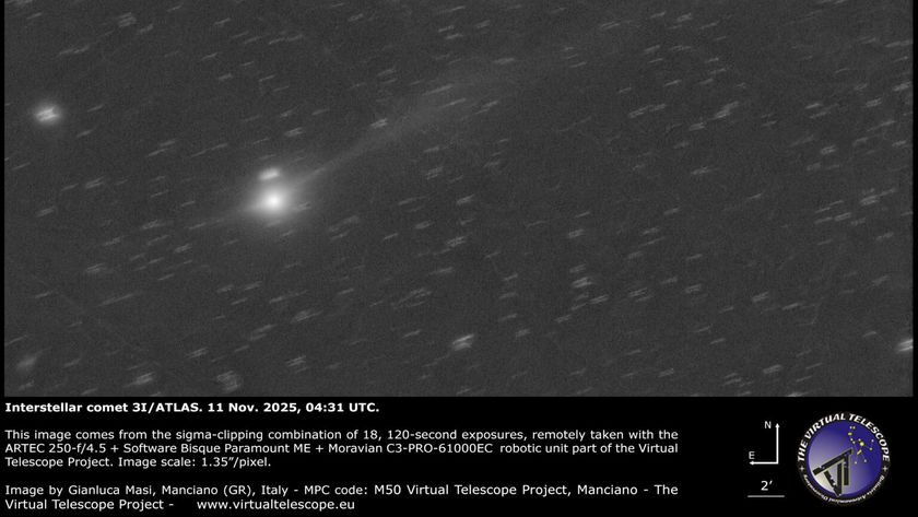 a grayscale image showing a white dot of 3I/ATLAS with a long white tail behind it.