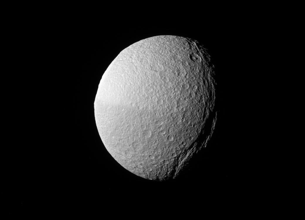Saturn Moon Tethys Giant Canyon Snakes Into Darkness In Cassini Photo 